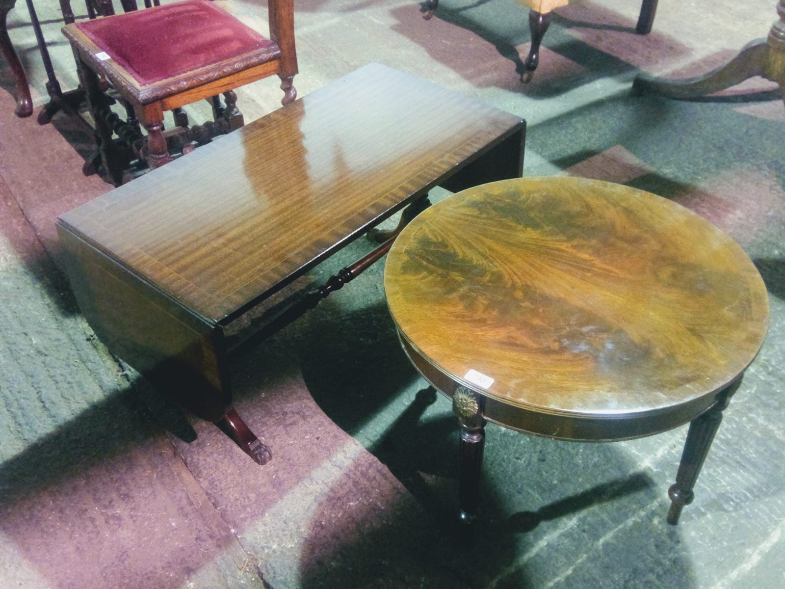 A reproduction mahogany coffee table hav