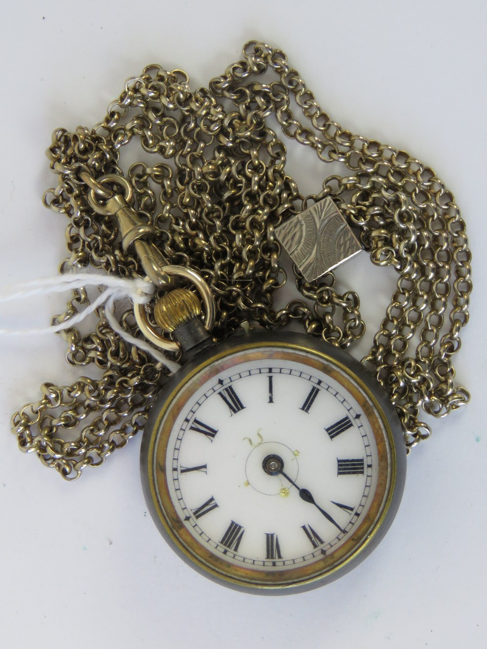 A white metal top wind fob watch having