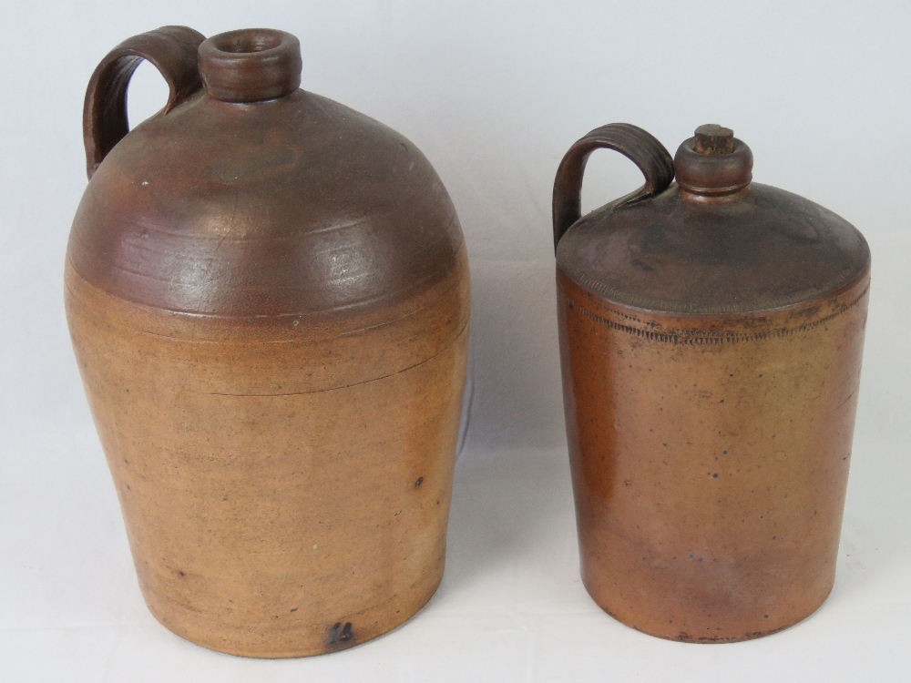 A large stoneware flagon with strap hand