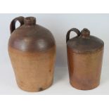 A large stoneware flagon with strap hand