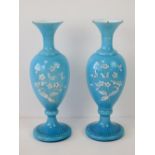 A pair of blue white cased art glass vas