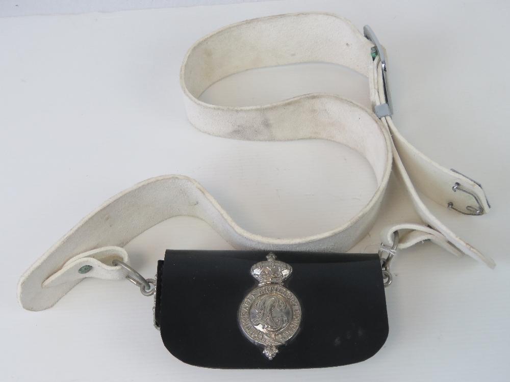 A white leather cross belt complete with buckle and black pouch bearing Honourable Artillery