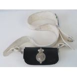 A white leather cross belt complete with buckle and black pouch bearing Honourable Artillery