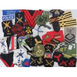 A quantity of cloth military badges, various ages, including; Welsh Police, epaulettes, AFS,