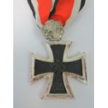 A WWII German Knights Cross medal with Oak Leaves and ribbon.