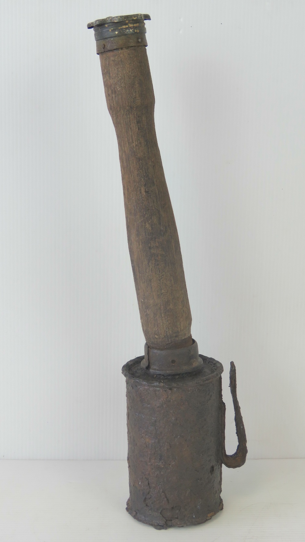 An inert WWI German stick grenade in relic condition.