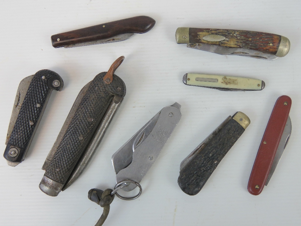 Eight British Military pocket or pen knives.