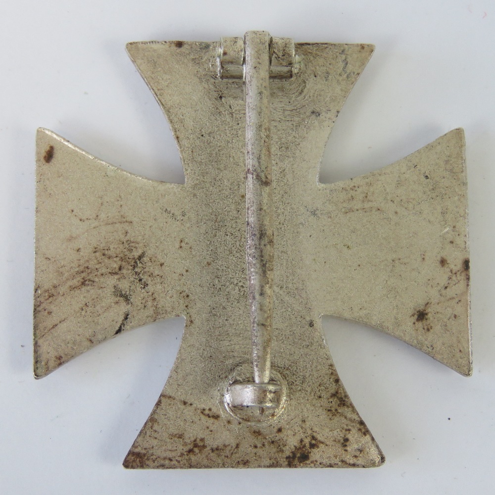 A WWII German Iron Cross 1st Class together with an Iron Cross ring (a/f cut band). Two items. - Image 2 of 3