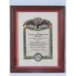 A framed and glazed WWII German Workers certificate.