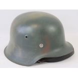 A good reproduction WWII German Infantry helmet, camo painted with liner and chinstrap.