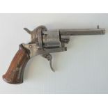 A 19th century Belgian pinfire 7mm calibre revolver having octagonal barrel and wooden handle.