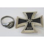 A WWII German Iron Cross 1st Class together with an Iron Cross ring (a/f cut band). Two items.