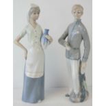 A pair of Spanish porcelain figures by Casades, 28.5cm and 29cm high.