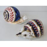 Two Royal Crown Derby paperweights; snail approx 13cm and hedgehog approx 11cm,