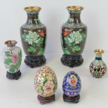 A pair of Chinese cloisonné vases decorated with chrysanthemums,