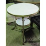 A white marble circular table in the Classical style having gilded metalwork throughout,