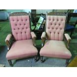 A fine pair of Edwardian button back elbow chairs.