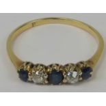 An 18ct gold diamond and sapphire ring, three graduated sapphires of good royal blue colour,