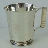 A HM silver tankard having turned ivory handle,