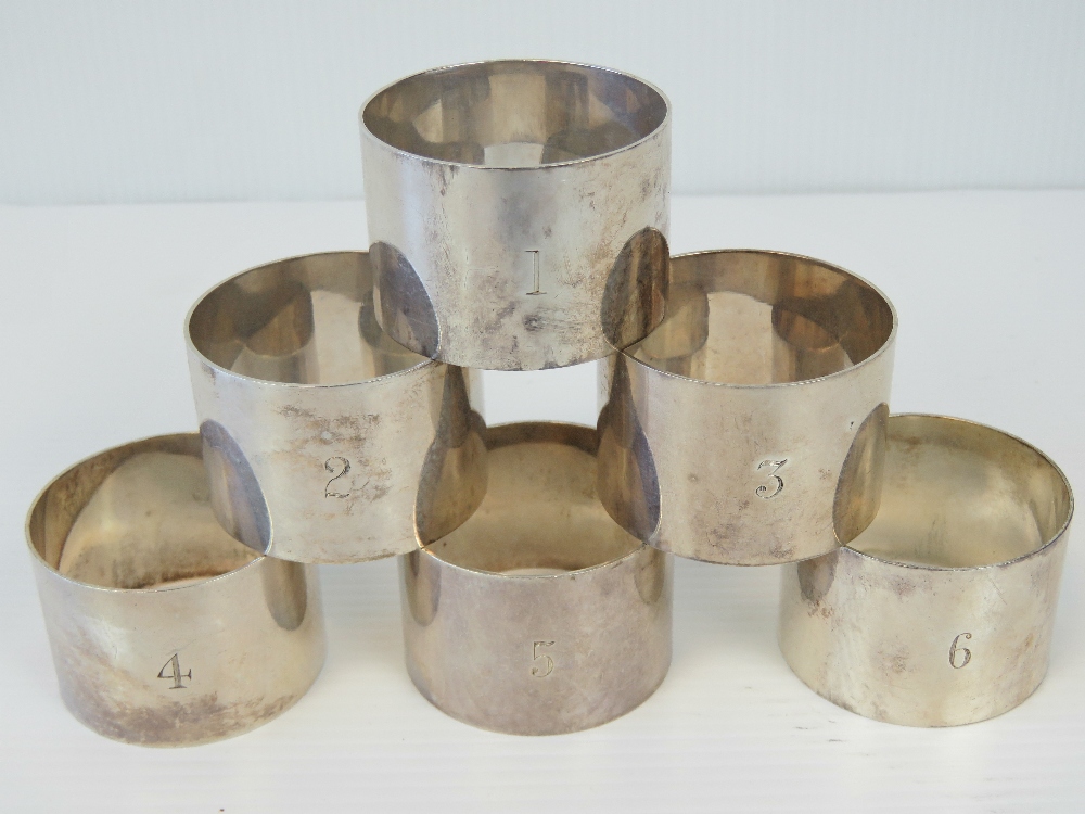 A set of six HM silver napkin rings, engraved 1 - 6,