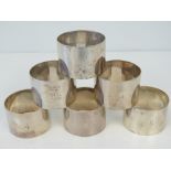 A set of six HM silver napkin rings, engraved 1 - 6,