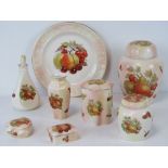 A quantity of Royal Worcester Spode Palissy ceramics in blush ground with fruit design upon