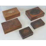 A mahogany rectangular box with carved and raised oval medallion to the lid and other carved