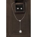 A diamond and 18ct gold De Beers 'Wildflowers Collection' suite comprising necklace and stud