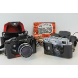A Praktica LLC SLR camera with ever ready case and strap and a Zorki 4K SLR camera with e/r case