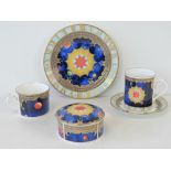 A Royal Worcester 2000AD commemorative millennium set comprising cup, saucer, side plate,