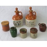Two stoneware Scotch whisky jugs complete with stoppers, a Fulham pottery tobacco pot,