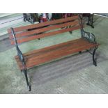 A contemporary iron framed slatted garden bench, 4ft (122cm) wide.