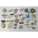 A quantity of assorted 20th century brooches including; a fob watch by Sambra, floral examples,