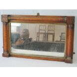A 19th century architectural overmantle mirror in maple having gilded interior, measuring 46 x 76cm.