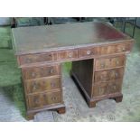 A good 19th century pedestal kneehole desk having twin frieze drawers with three drawers to each