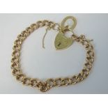 A 9ct gold curb link charm bracelet with heart padlock clasp, hallmarked 375,