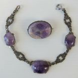 A vintage sterling silver bracelet set with marcasites and three graduated Blue John cabachons,