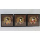 Three framed relief geisha girl busts in decorative settings. Frames 18 x 18cm.