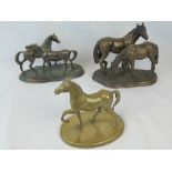 Three contemporary horse figurines.