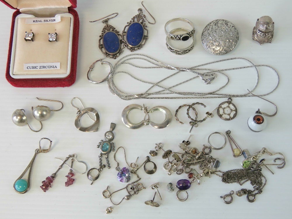 A quantity of assorted silver and white metal jewellery including; floral engraved lapel stud,