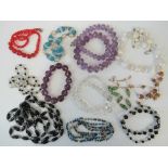 A quantity of assorted vintage glass bead necklaces including handpainted example, amethyst glass,