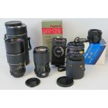 A Vivitar 70-150mm camera lens, a Tokina SL28 lens, a Chinon 200mm lens,