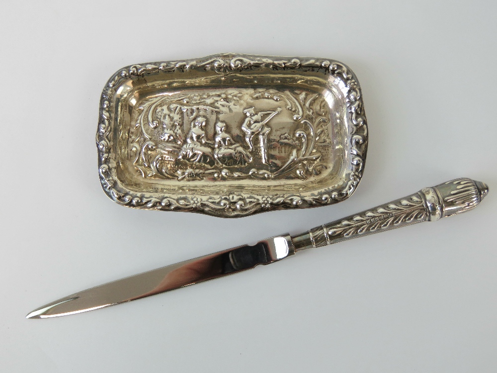 A HM silver pin dish having repousse scene of musician and audience upon, hallmarked Sheffield 1985,