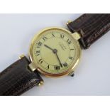 A Must de Cartier ladies wrist watch having round silver-gilt '925' watch head,