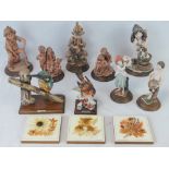 A small collection of Armani resin figures of children and birds, etc, twelve items.