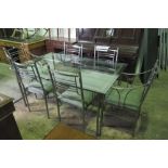 A contemporary metal framed dining table having glass top, 163 x 102cm,