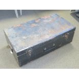 A large black painted metal travel trunk having drop end handles, 93 x 52 x 34cm.