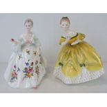 Two Royal Doulton figurines; Diana HN2468 standing 20cm high,