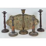 Two pairs of lacquered turned wooden candlesticks, one of Moorish design,