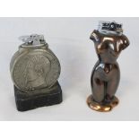 Two table lighters; one in bronze lustre of a nude female figure,